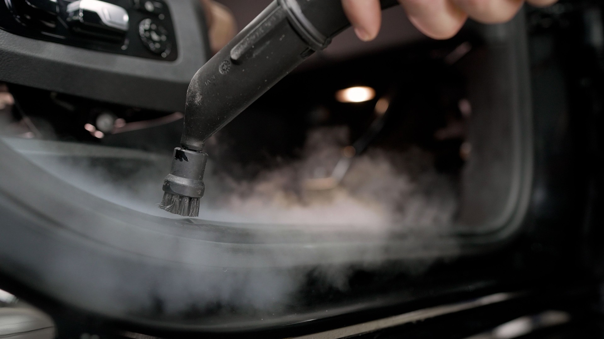 Cleaning the car interior with steam. Car detailing service deep interior cleaning. Detailing the car